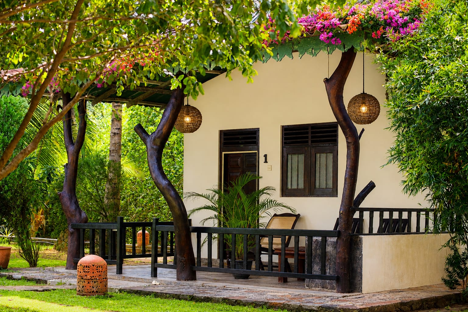 Bungalow veranda with rattan lanterns and bougainvillea at Ginger Harmony Tangalle